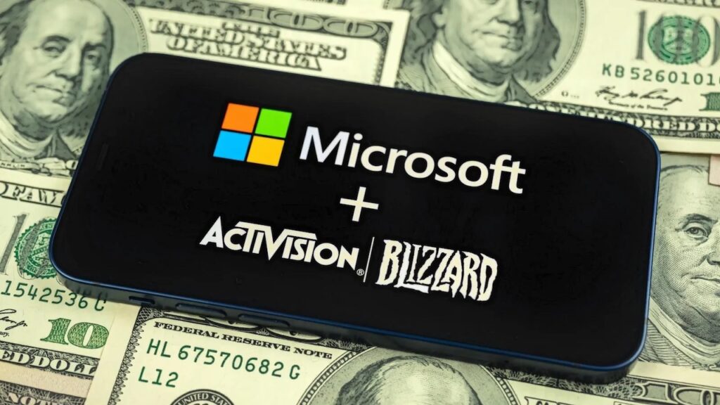 Il logo di Microsoft ed Activision Blizzard con i dollari sullo sfondo