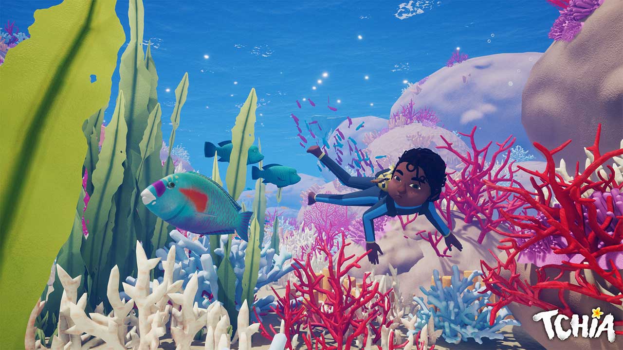 Una ragazza che nuota tra i coralli
