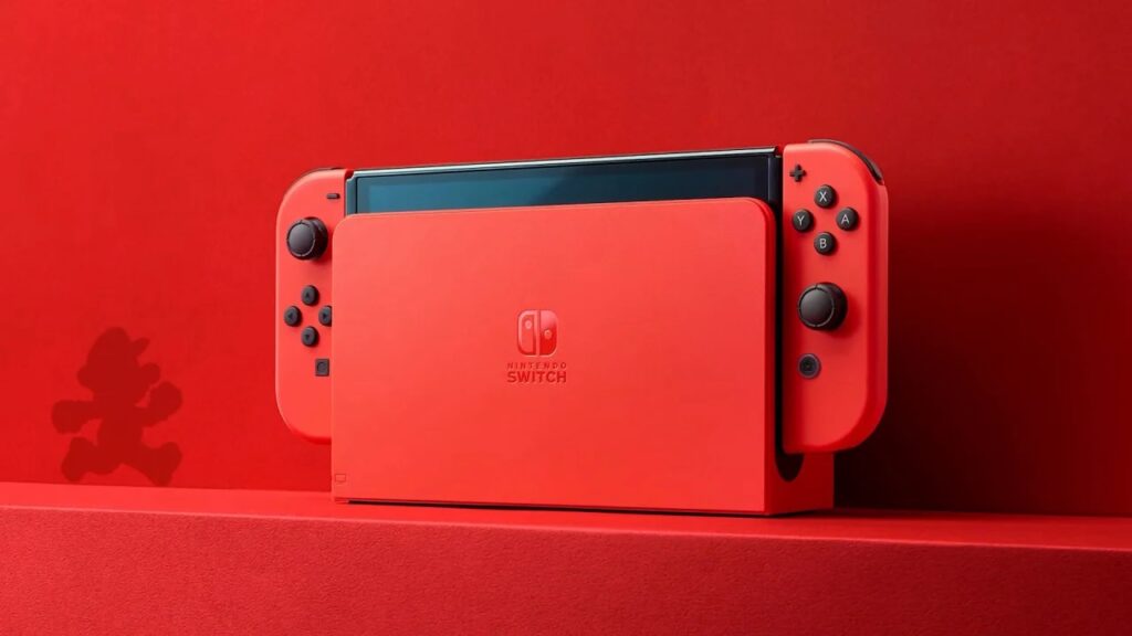 La nuova Nintendo Switch Modello OLED Mario Red Edition in primo piano con uno sfondo rosso
