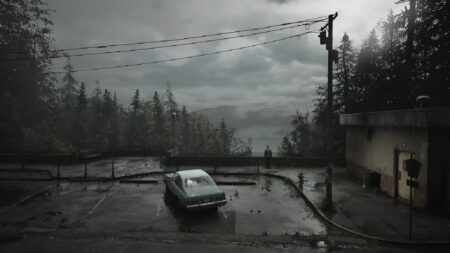 Silent Hill 2 Remake potrebbe non essere l’unico remake della serie in arrivo Un'immagine di Silent Hill 2 Remake che mostra un'auto in un parcheggio sotto a un cielo nuvoloso e con una foresta sullo sfondo.