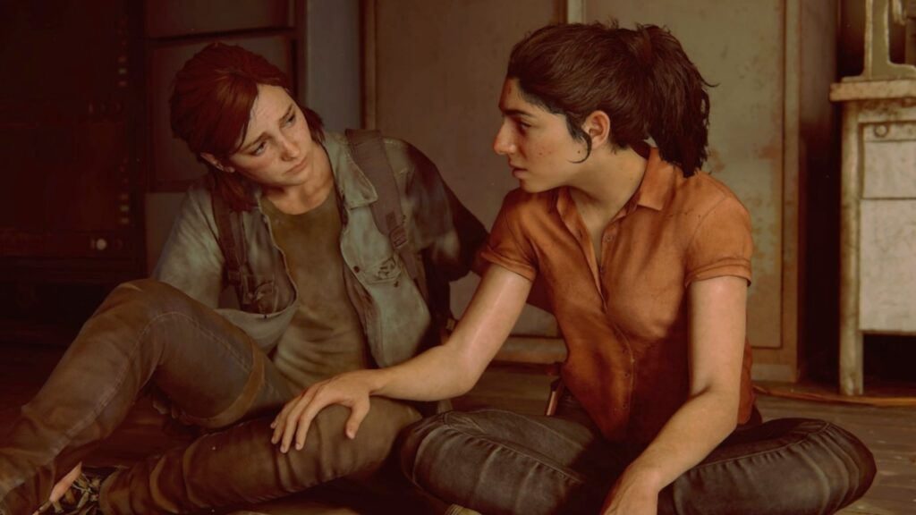 Ellie e Dina di The Last of Us Parte 3 Remastered sedute a terra