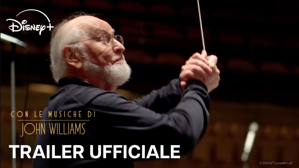 John Williams in primo piano con una bacchetta in mano