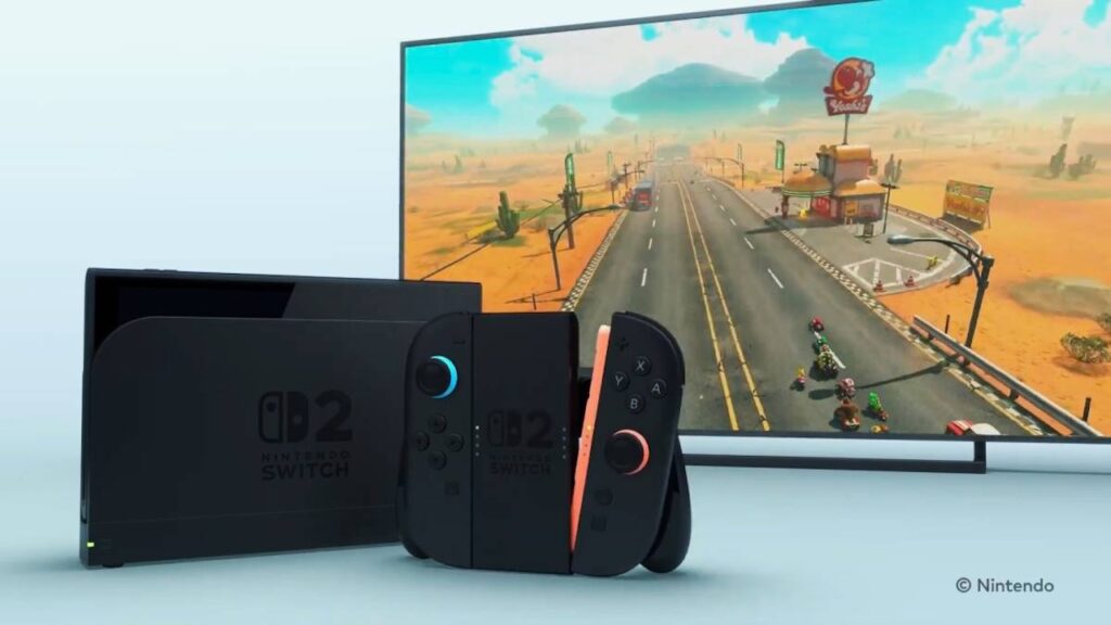 Una Nintendo Switch 2 nella Dock con dietro Mario Kart su un televisore