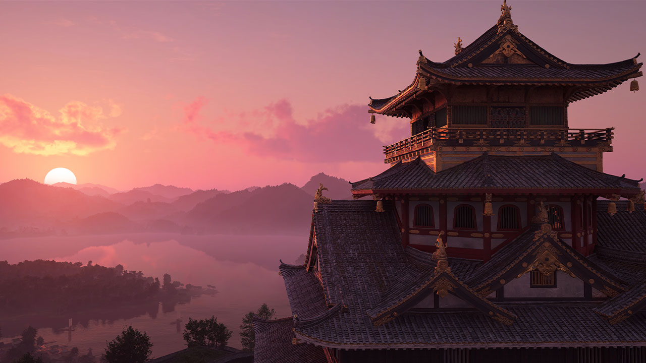 Assassin's Creed Shadows vista su un castello davanti a un lago al tramonto