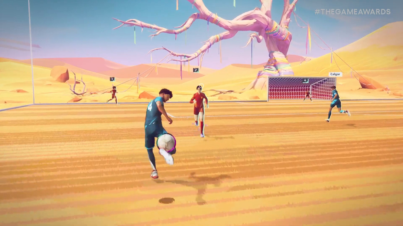 un calciatore col pallone in un campo di sabbia nel deserto