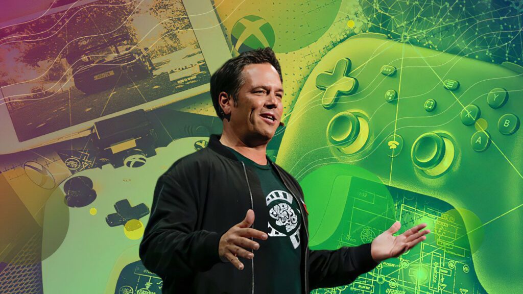 Phil Spencer con dietro dei controller