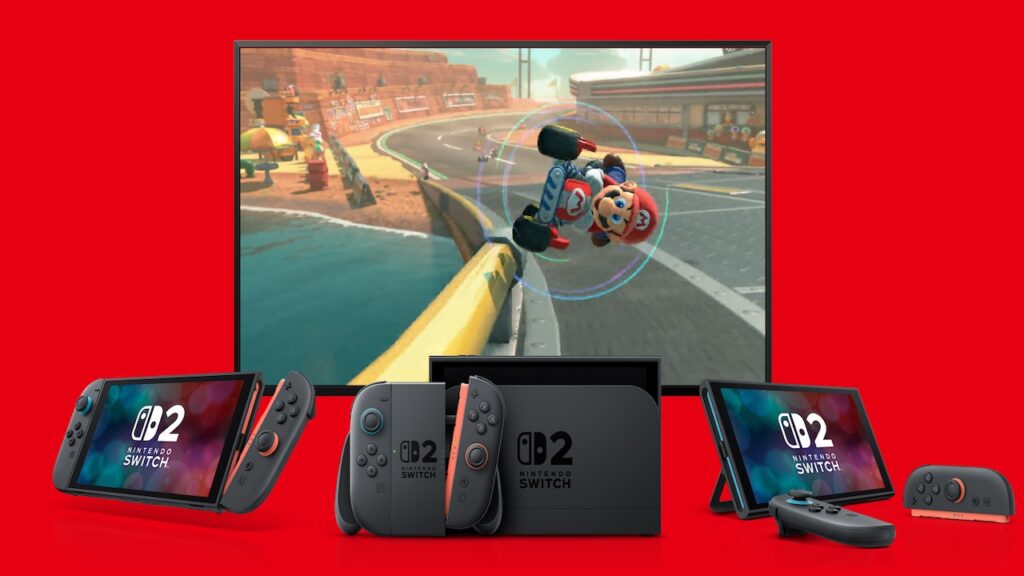 Tre Nintendo Switch 2 con dietro un TV con Mario Kart World