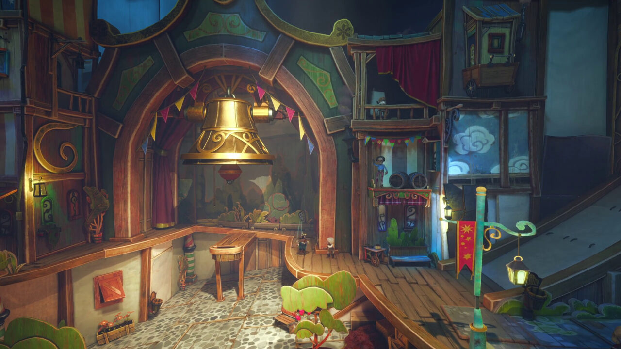 Once upon a puppet: palcoscenico luminoso con una campana dorata e alcuni oggetti di scena