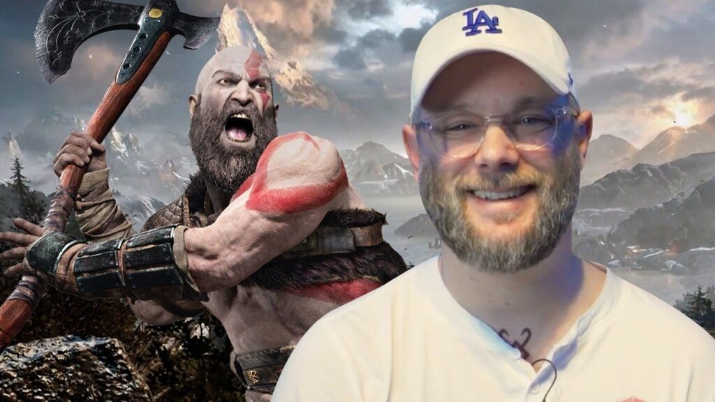 Cory Barlog con dietro Kratos di God of War