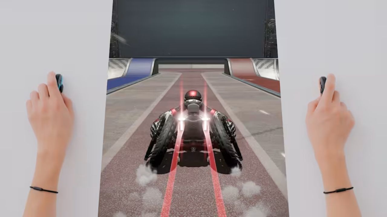 una persona con i joycon appoggiati al tavolo gioca a drag x drive