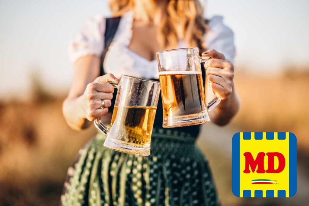 Donna con i calici di birra in mano