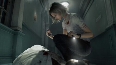 Grace di Resident Evil Requiem con una torcia in mano in un corridoio